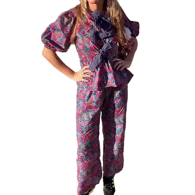 Women's floral print polyester trouser suit with puff sleeves and tie-neck blouse