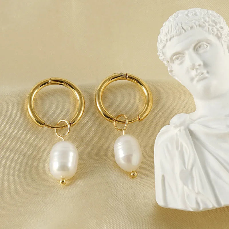 Gold-coloured geometric pearl earrings with stainless steel construction and titanium posts