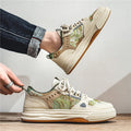 Beige and green canvas casual flat shoes with round toe on a white background.