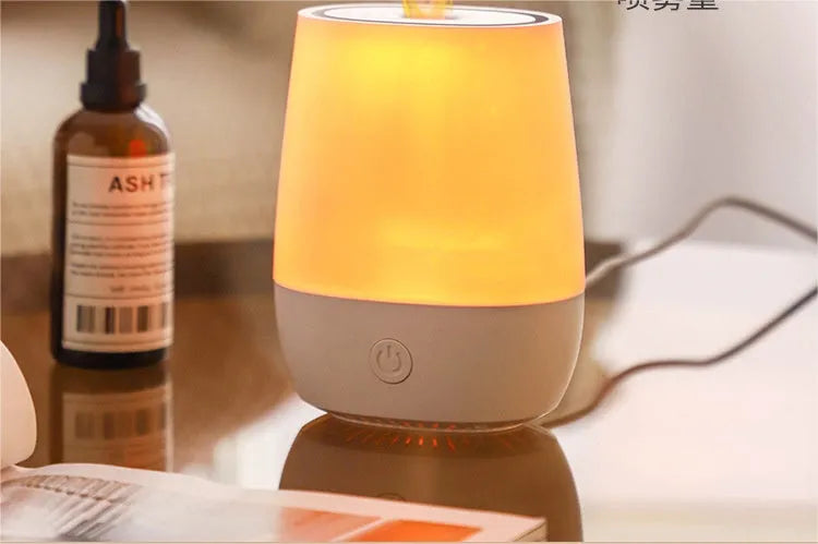 White USB aromatherapy humidifier with simulated flame effect, compact design with water tank