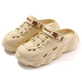 Men's khaki and black outdoor slippers with hollow-out patterned EVA soles for breathability.