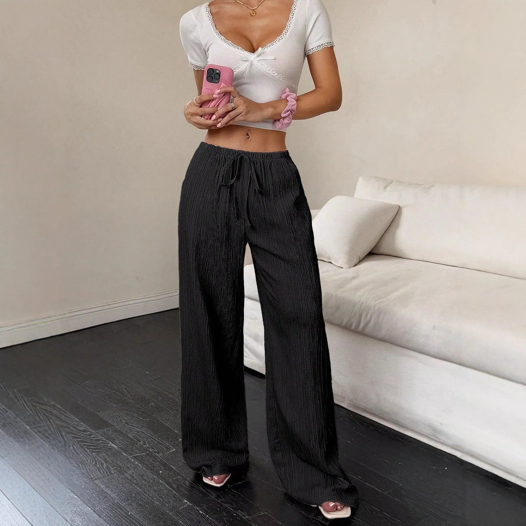 Women's wide-leg trousers with lace-up waist trim in black polyester fabric