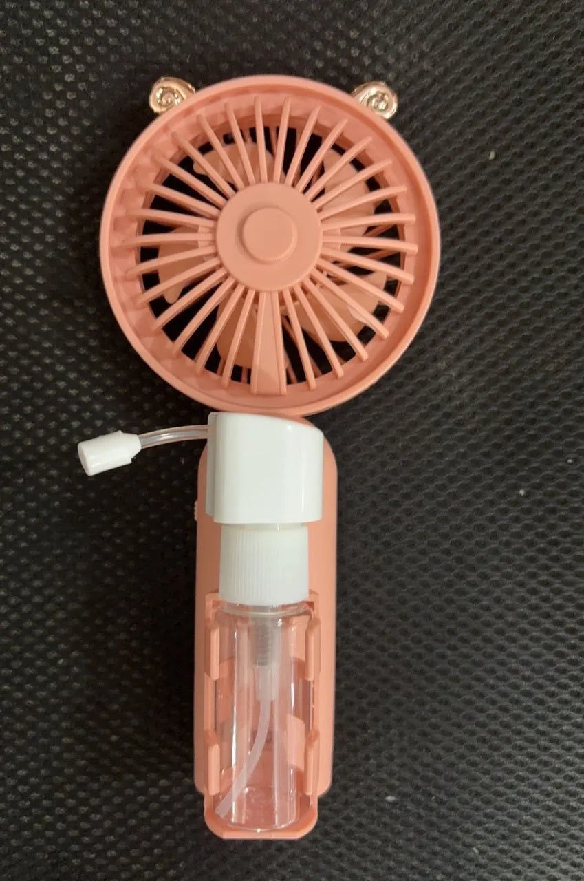 Compact plastic USB desk fan in choice of colours: apricot, blue, green, orange, or pink.