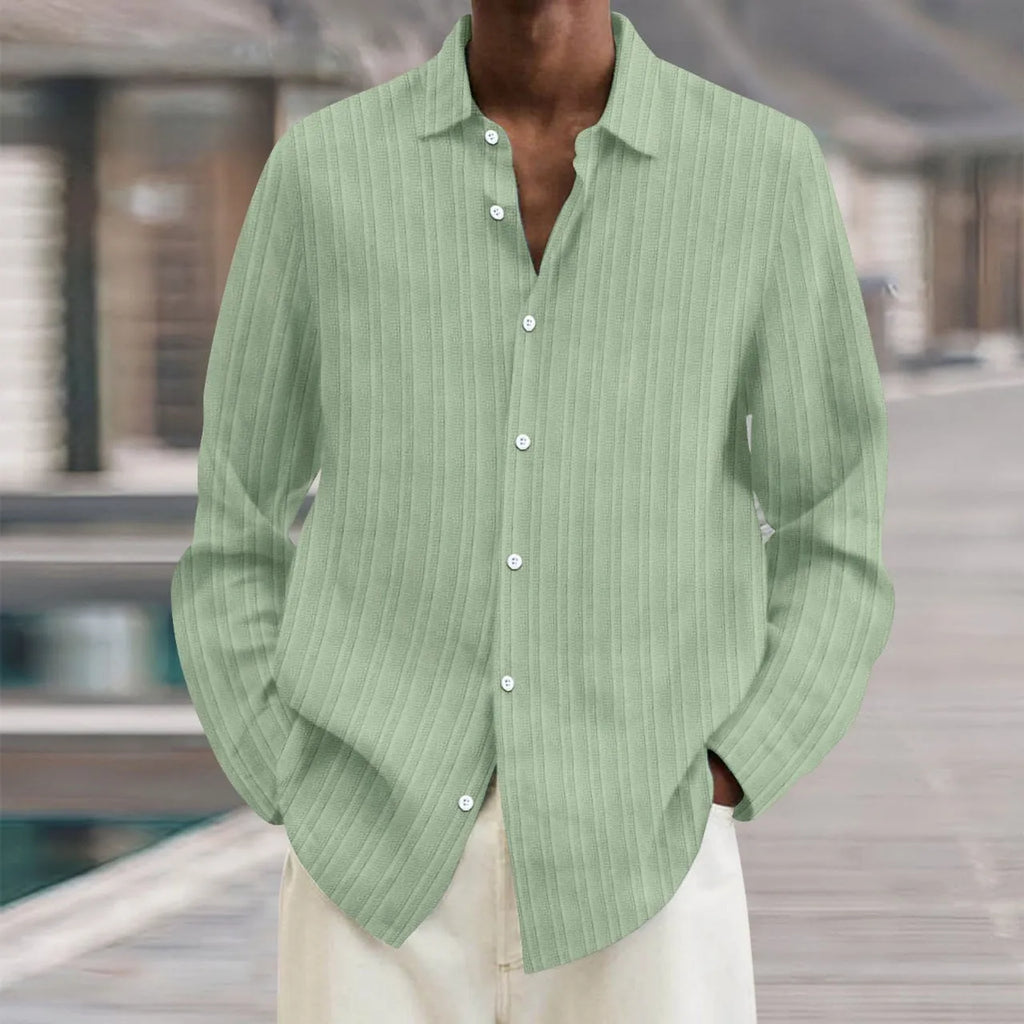 Man wearing a British-style striped cardigan with long sleeves and a loose fit