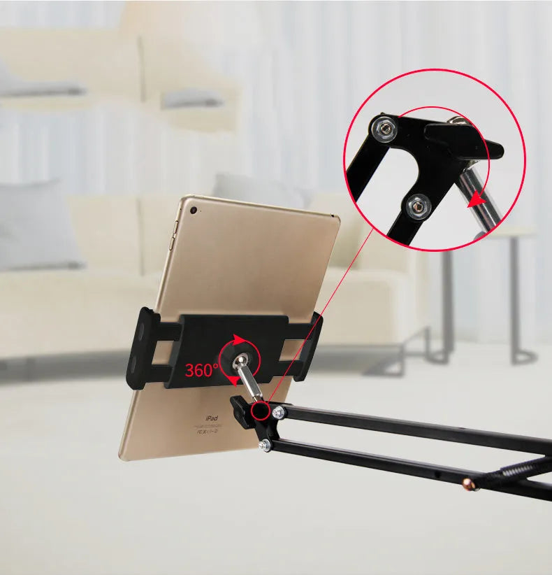 Adjustable black and white phone tablet stand on flat surface with mobile device
