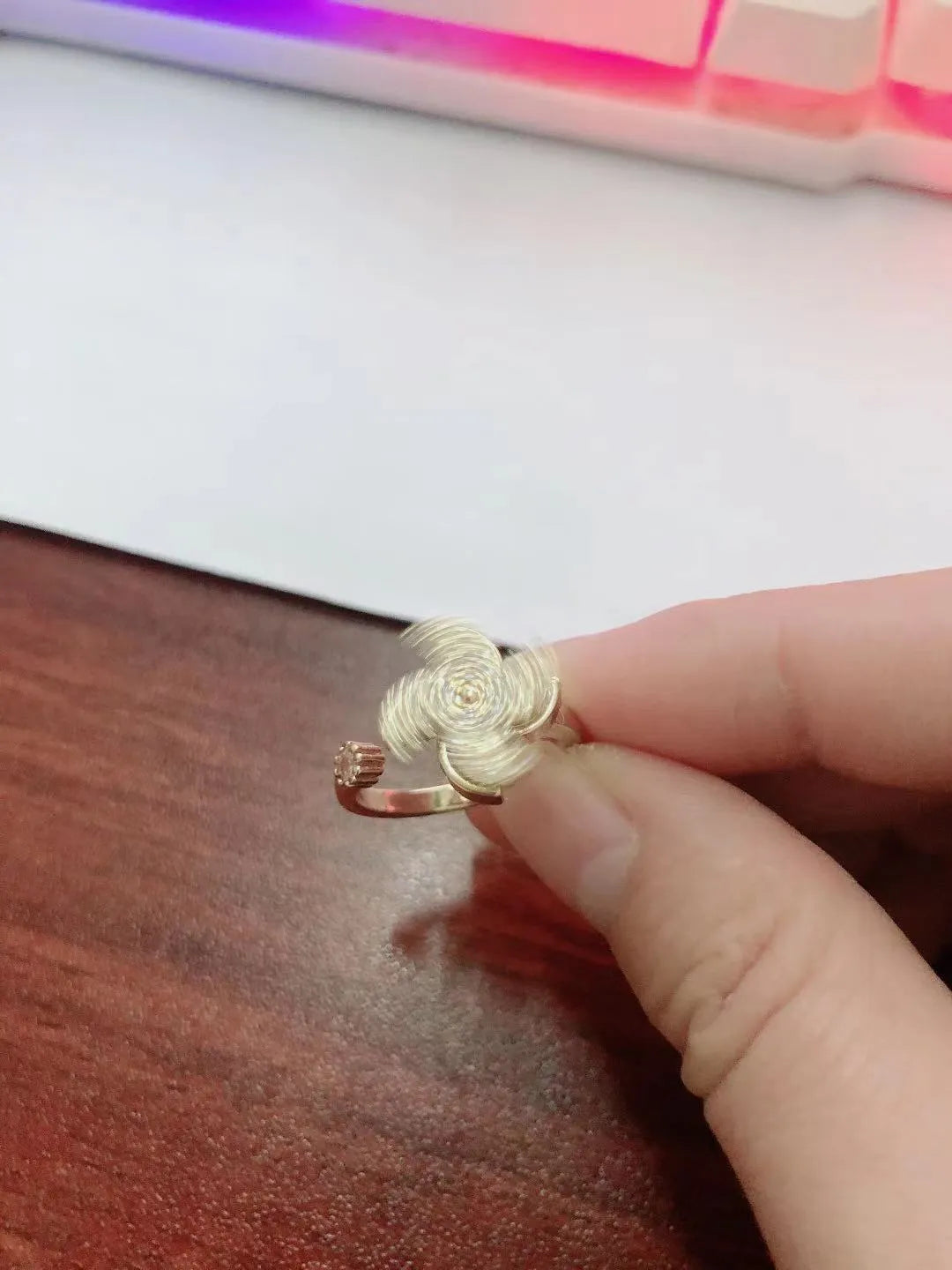 Copper geometric ring with rotating windmill design in gold or silver electroplated finish