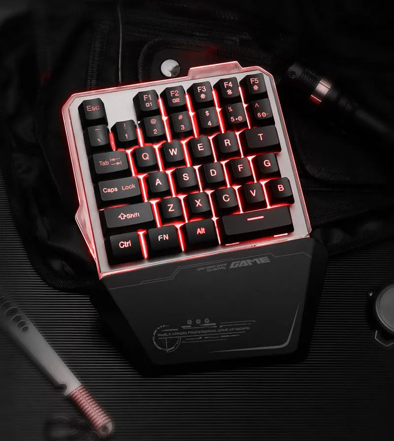 Black G40 one-handed mechanical gaming keyboard with RGB backlit keys on a desktop