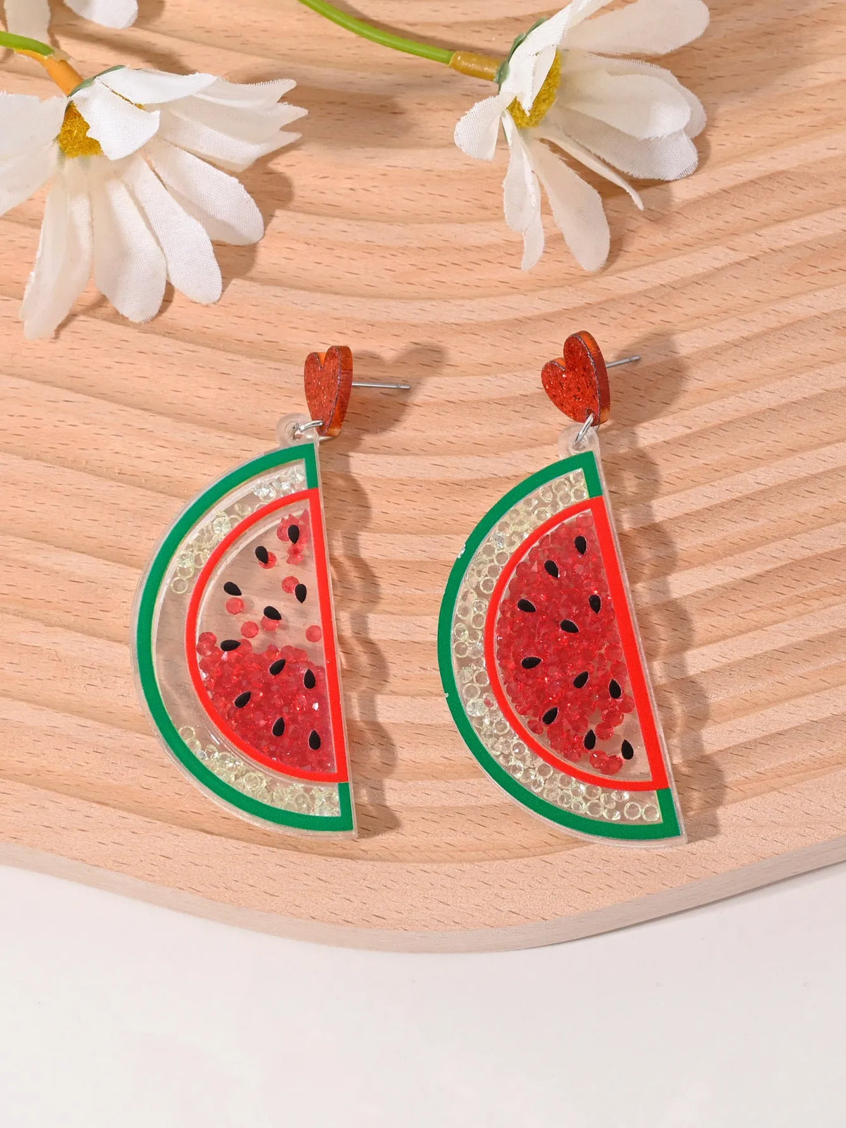 A pair of acrylic earrings shaped like a cherry, strawberry, watermelon, pineapple, coconut cake, or ice cream.