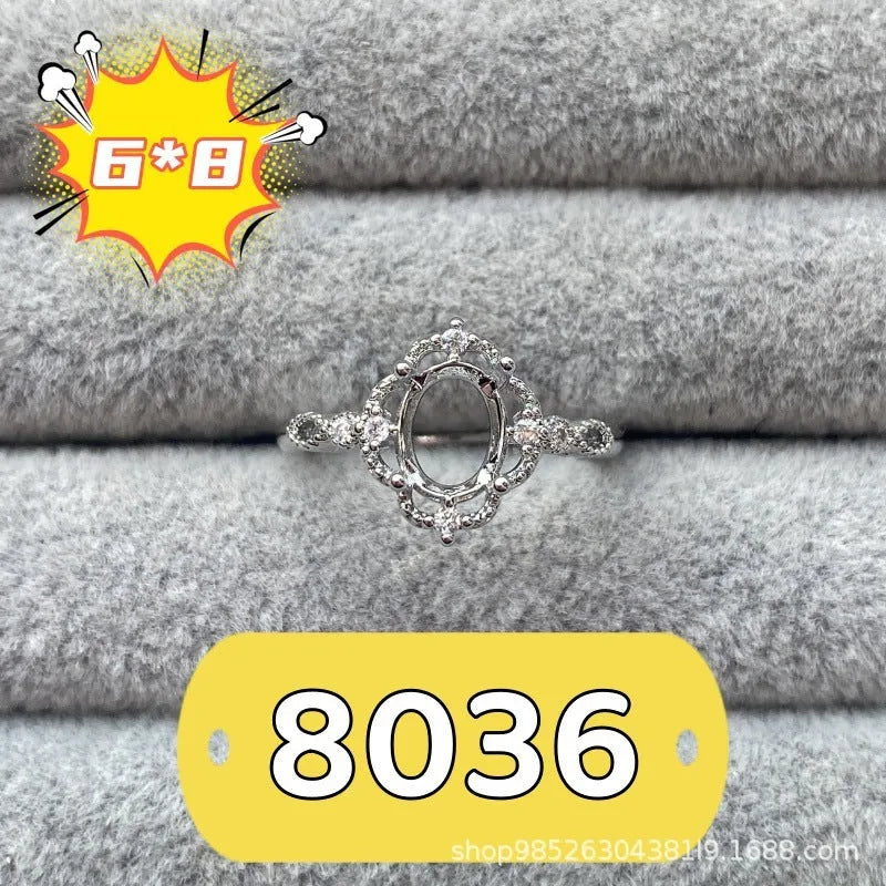 Oval denier ring with 6x8mm stone and five-pointed star element on copper band