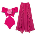 One-piece swimsuit with hollow-out design paired with matching umbrella skirt in polyester fabric
