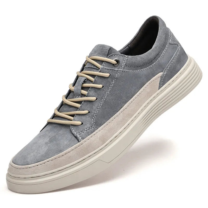 Men's grey pigskin leather casual skate shoes with a flat rubber sole and lace-up front.