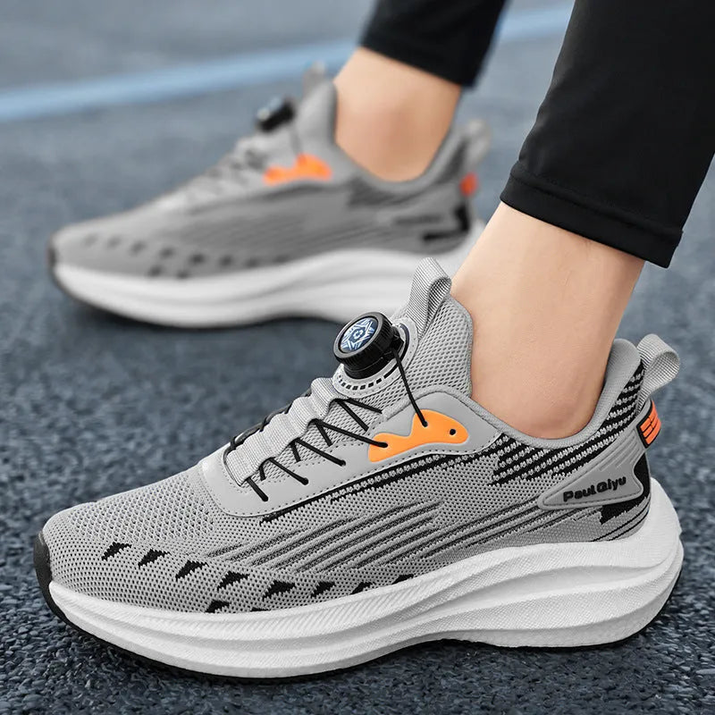 Men's white and green running shoes with rotating buckle and mesh upper on a flat TPU sole.