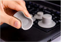 Two large and two small grey plastic laptop cooling pads on a flat surface.