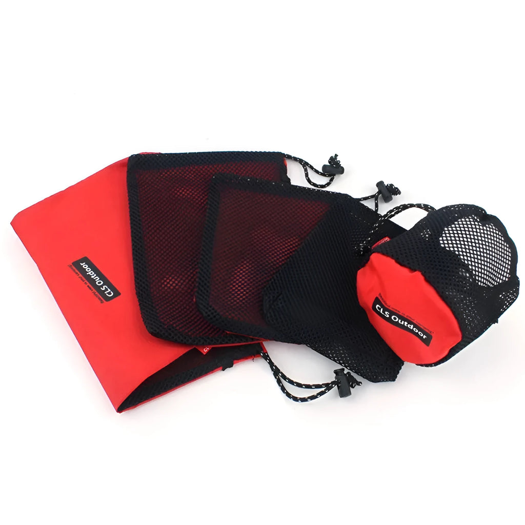 Red five-piece outdoor travel storage bag set with zipper closures on open bags showing internal pockets