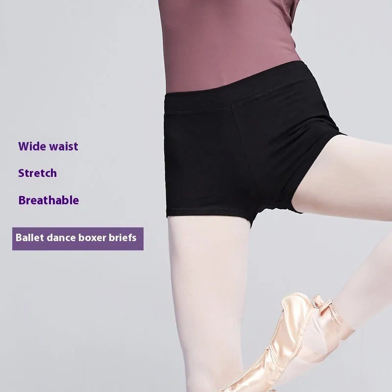 Black cotton women's dance practice shorts laid flat, shown in a solid colour.