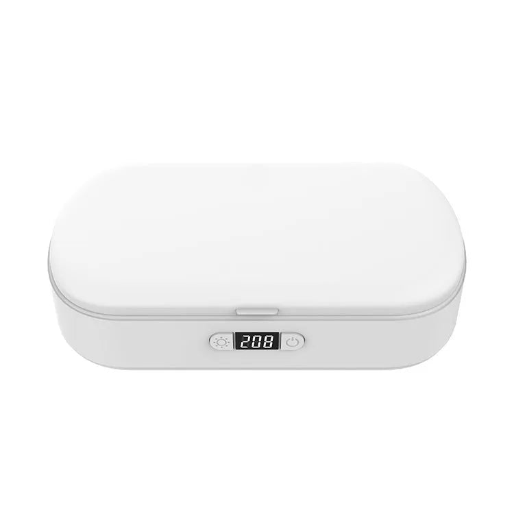 White ultraviolet steriliser box with wireless charging for mobile phones and personal items