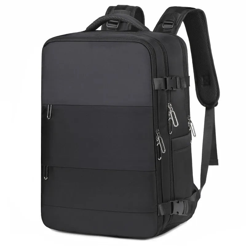 Large purple travel backpack with multiple compartments, shown next to a laptop.
