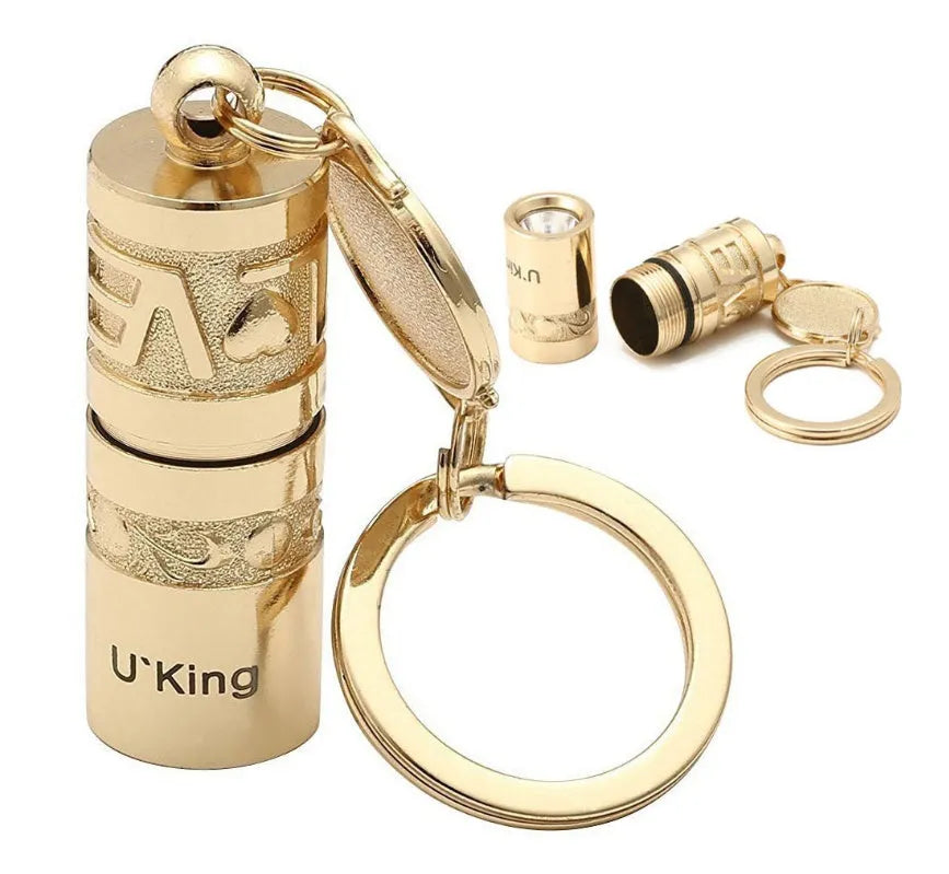 Gold-coloured zinc alloy mini LED keychain flashlight with a keyring.
