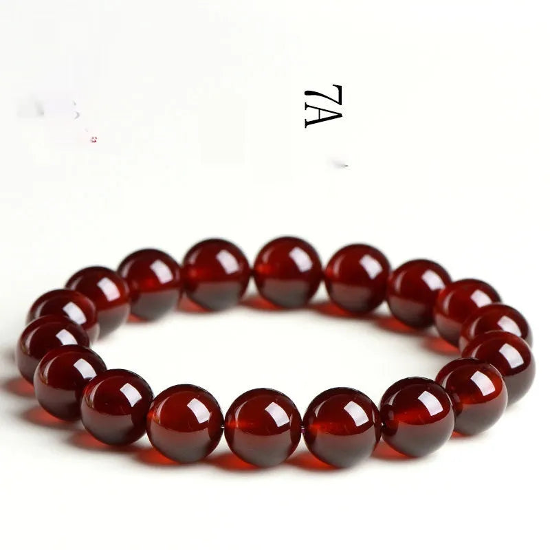Natural orange red garnet crystal bead bracelet with retro design on wrist