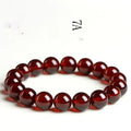 Natural orange red garnet crystal bead bracelet with retro design on wrist