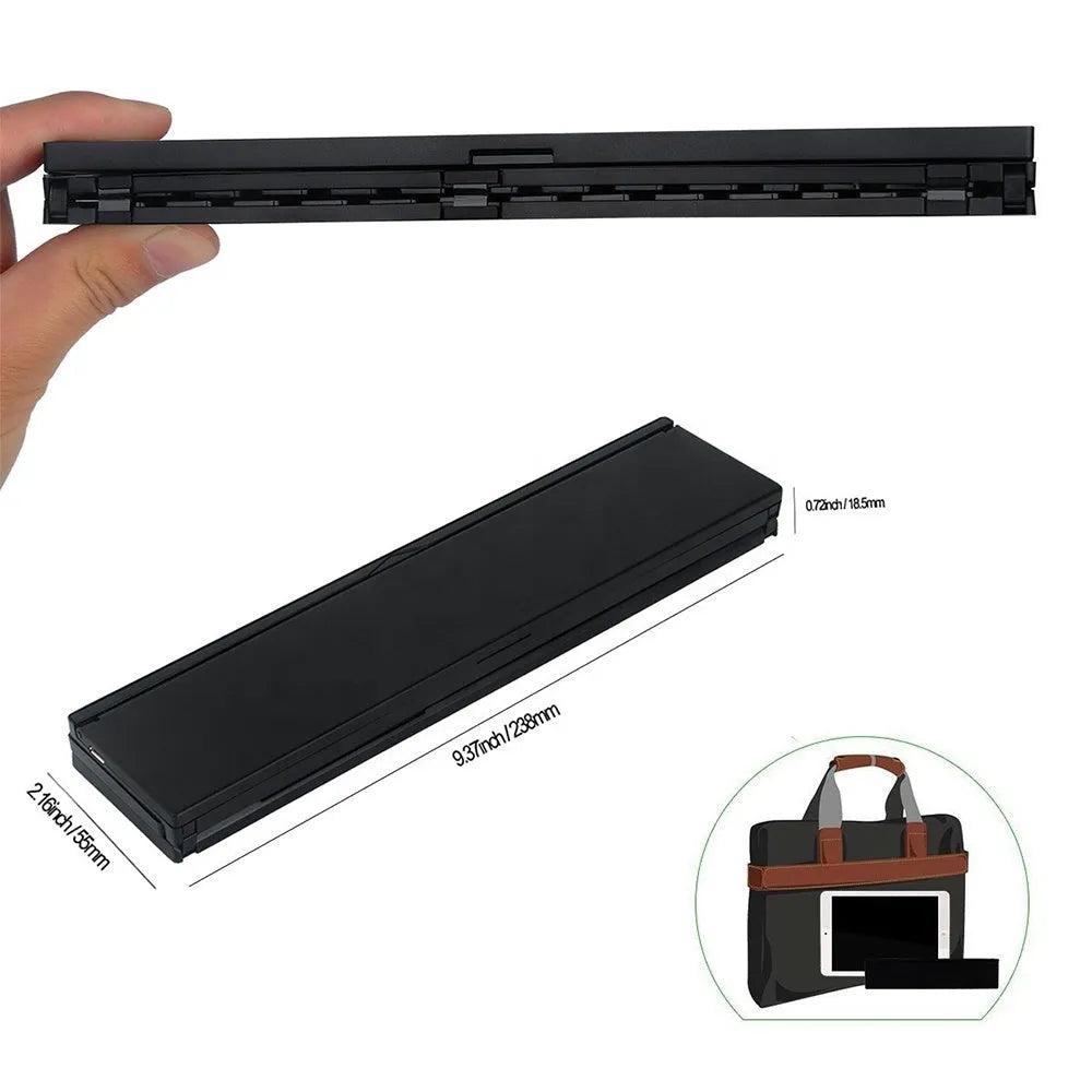 Black mini folding Bluetooth keyboard with bamboo pattern beside 7-inch tablet