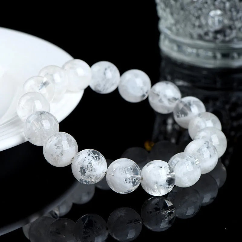 Women's crystal bracelet with round blizzard snowflake beads and ruyi xiangyun charm.
