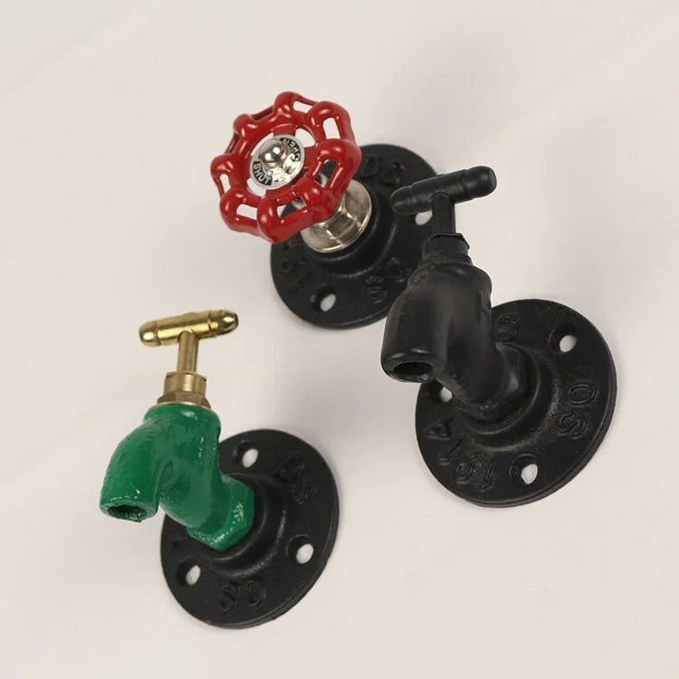 Metal wall hook with water pipe style frame in a choice of three colours.