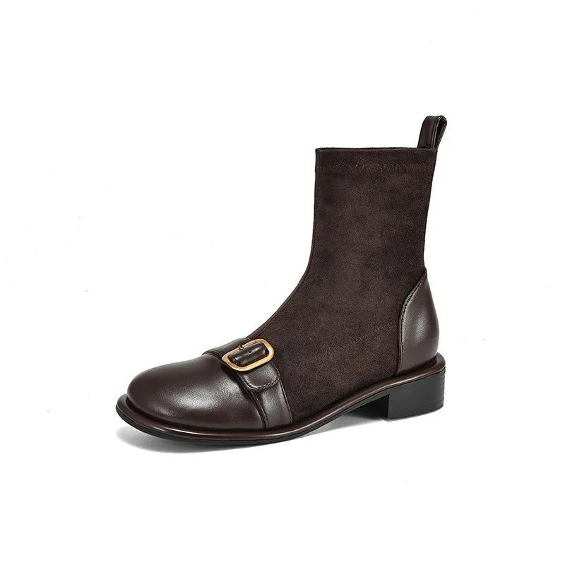 Black women's low heel Martin boots with belt buckle stitching and round toe.