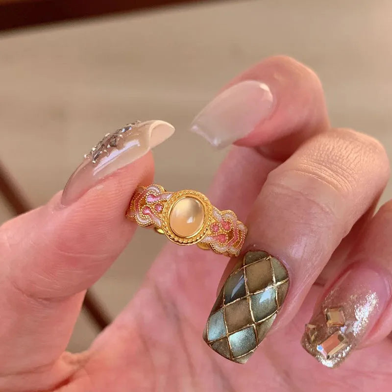 Pink crystal enamel geometric open mouth ring for women with gold plating.