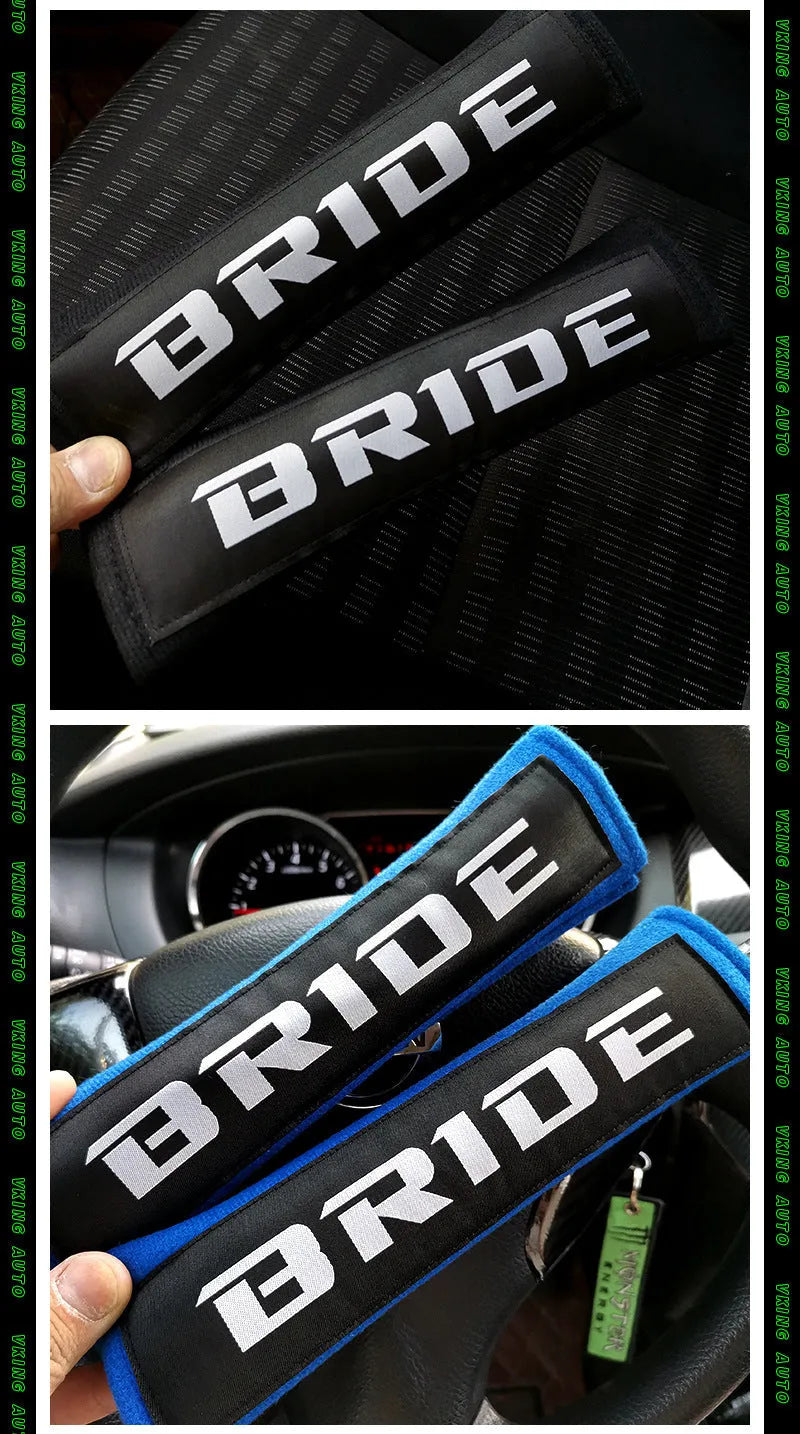 Pair of black cotton seatbelt shoulder pads with embroidery detail, showing dimensions