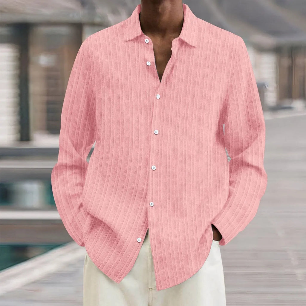 Man wearing a British-style striped cardigan with long sleeves and a loose fit