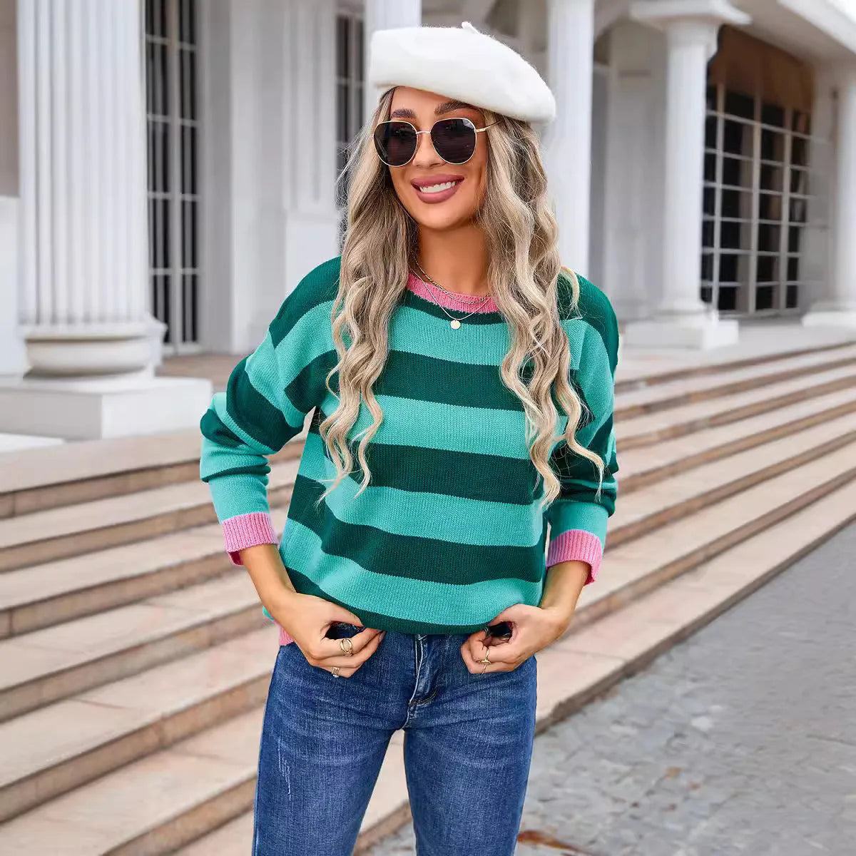 Blue loose-fit women's acrylic sweater with long sleeves and a striped pattern.