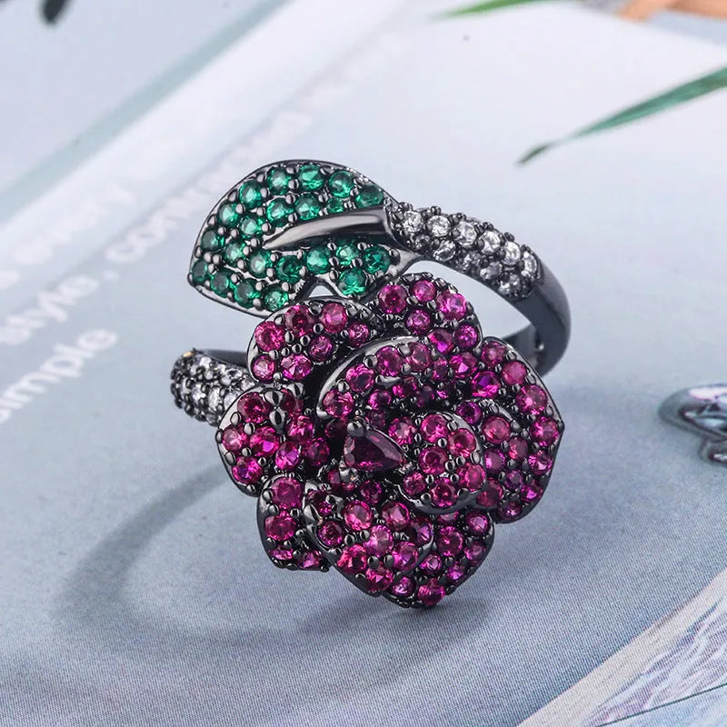 Black gold geometric floral ring with diamond-treated red corundum stone on copper band