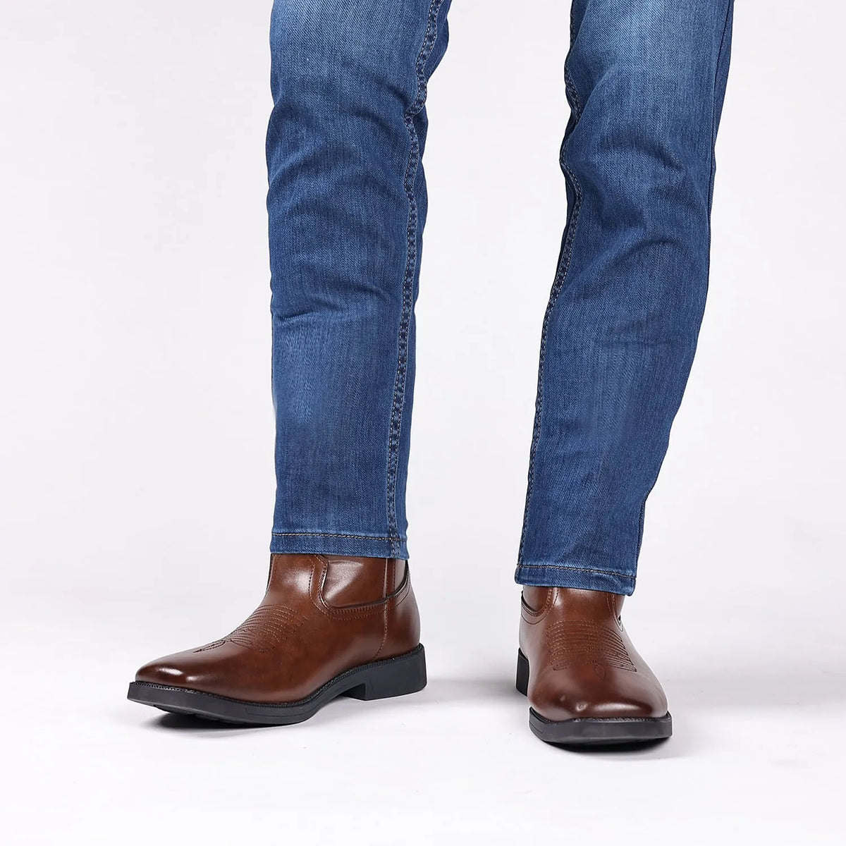 Men's brown retro cowboy boot with square toe and high top embroidered detail on artificial leather.