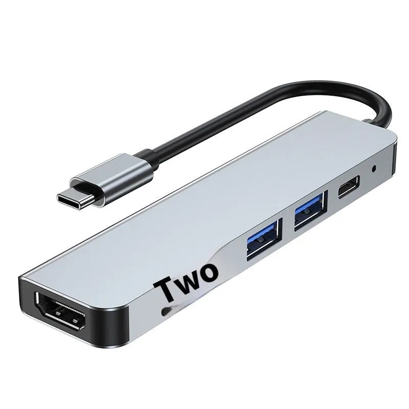 Six-in-one USB-C expansion dock for laptops with HDMI, USB ports, and card readers