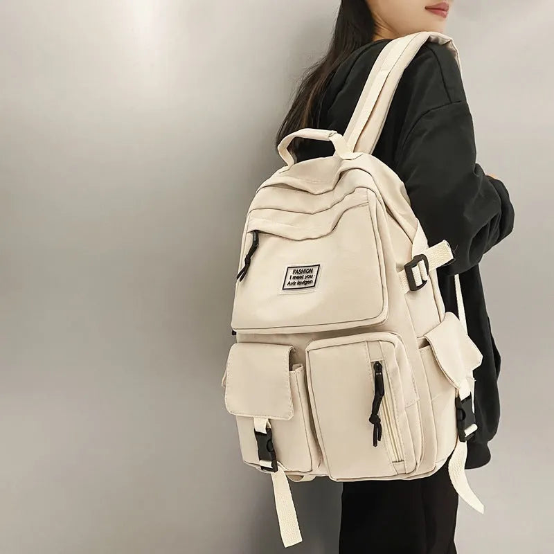 Black and white nylon student backpack with laptop compartment and external pockets