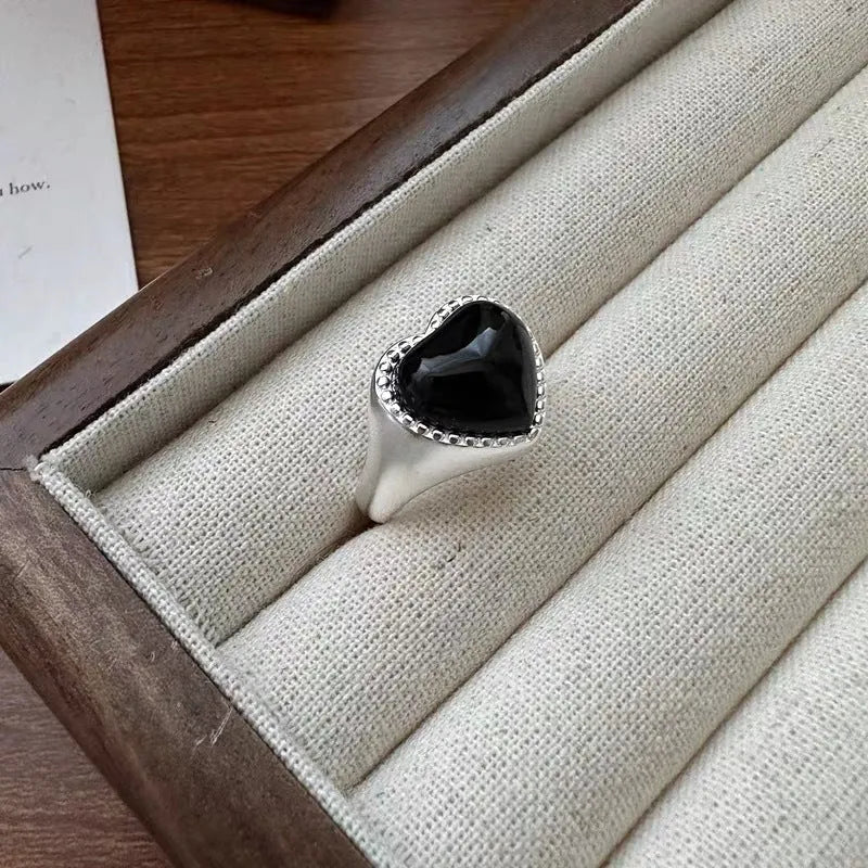 S925 sterling silver adjustable ring with black agate heart in open mouth design.