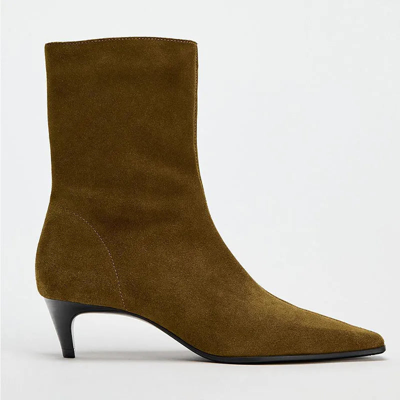 Women's brown square toe mid-calf boots with side zipper and retro kitten heel on wooden floor