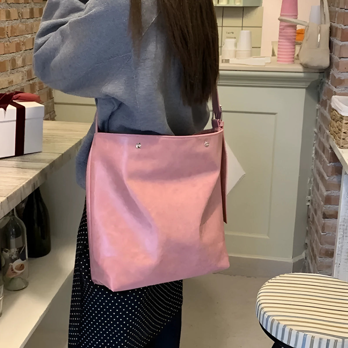 Pink corduroy one-shoulder crossbody bag showing front view and size.