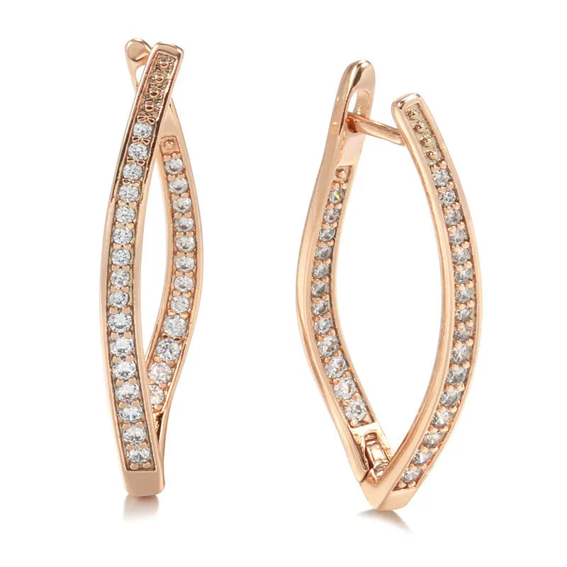 A pair of geometric-shaped copper earrings with zircon detail in H0493 colour, shown from the front.