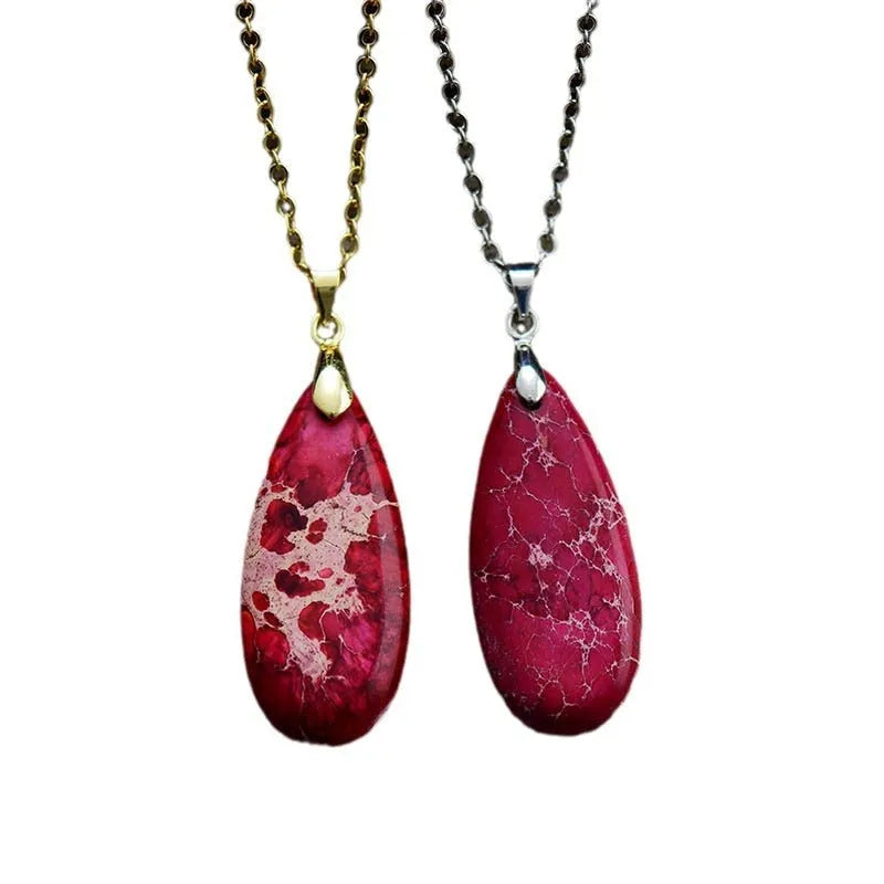 Water drop shaped emperor stone jade pendant on an 18K gold plated chain necklace.