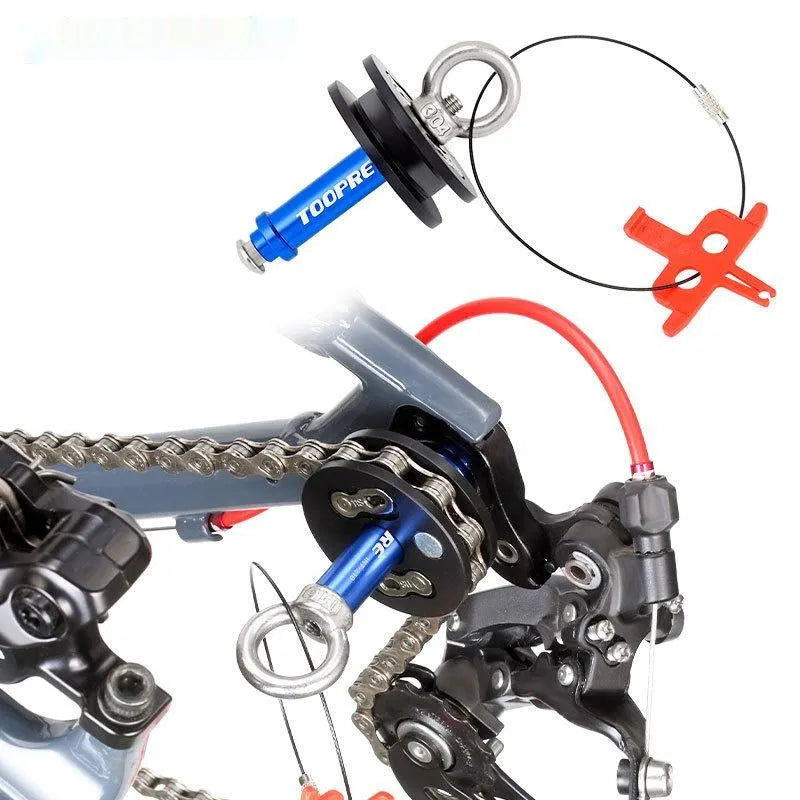 Aluminium bicycle chain holder and tensioner tool for washing, shown in hand.