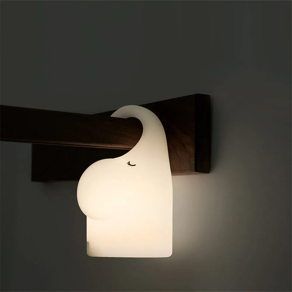 Elephant-shaped silicone night light with warm white LED glow for bedroom bedside use