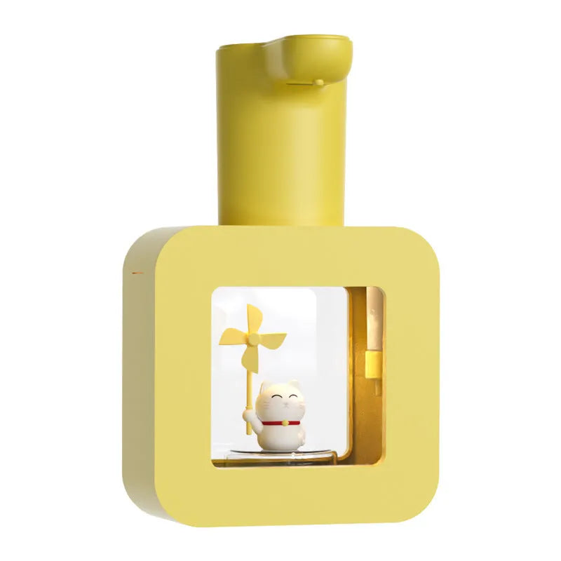 Pink automatic touchless foam soap dispenser for kids with a cute cartoon unicorn design.