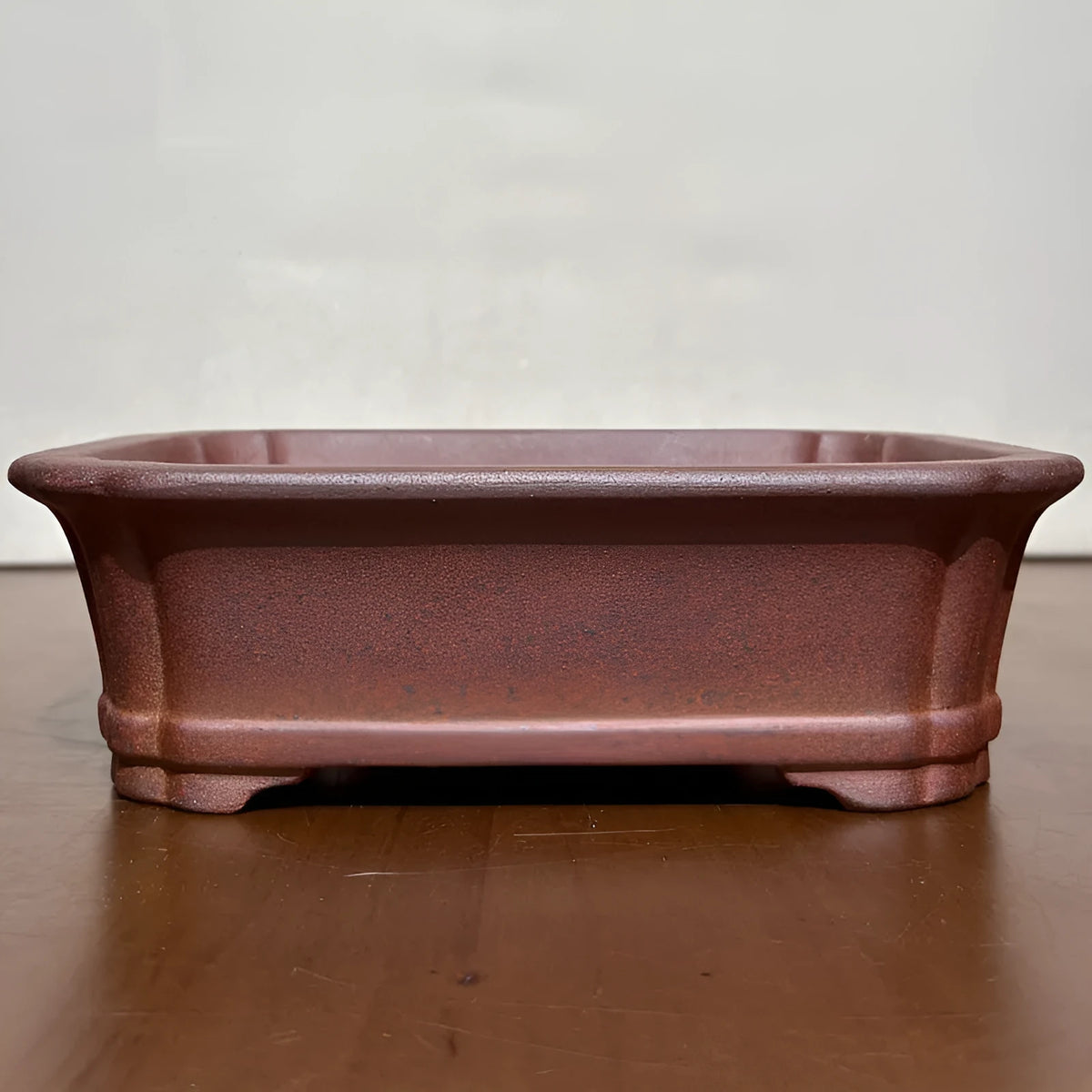 Rectangular stoneware flower pot in reddish brown with hand-glazed finish and 17cm base, for bonsai or firewood display.