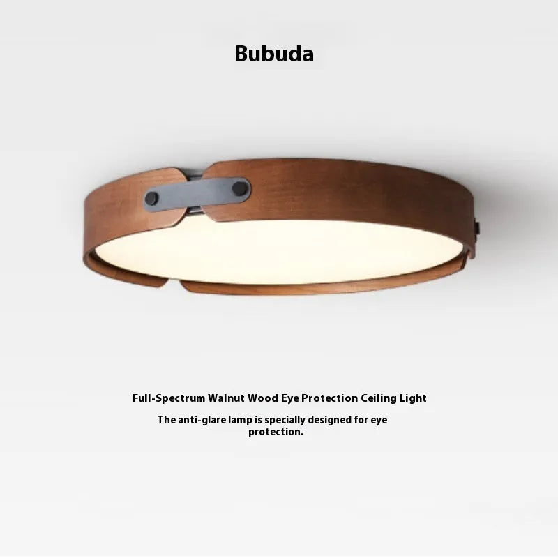 Japanese style wooden ceiling lamp with a PMMA shade in a warm light colour, shown in a bedroom setting.
