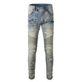 Light blue men's slim fit distressed jeans with hand-frayed details on a mid waist, showing a light straight leg cut.