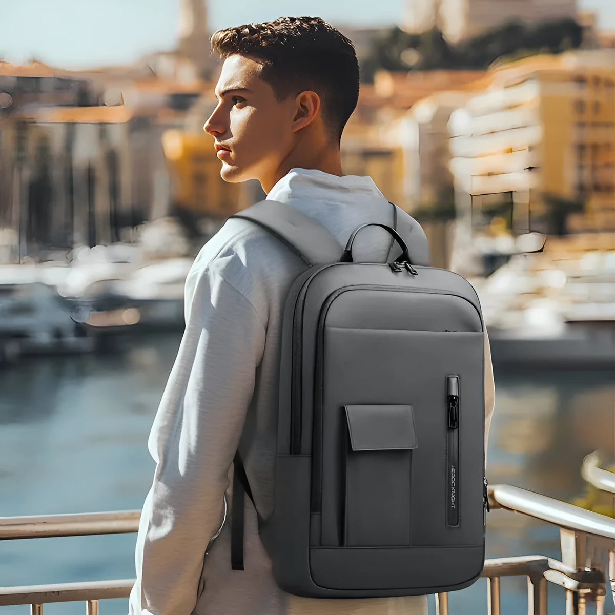 Men's solid colour Oxford cloth backpack in lightweight design for business travel.