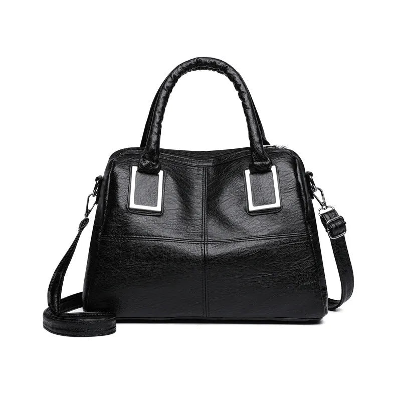 Women's large capacity shoulder bag in horizontal square shape with internal phone and document pockets.