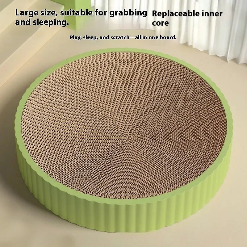 Round green cat scratching board made from corrugated cardboard with two replacement inserts